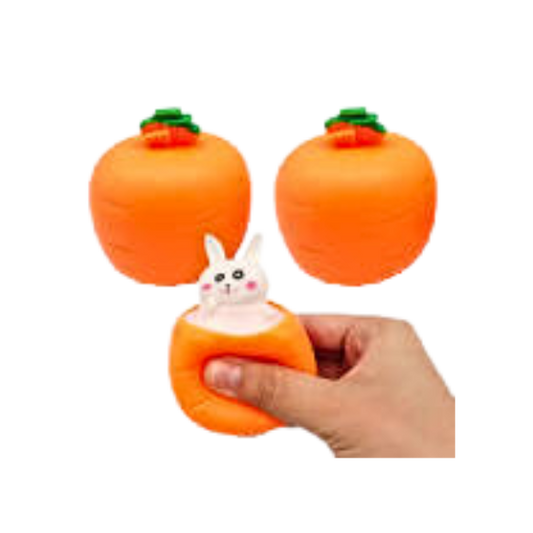Orange coloured and shaped squeeze toy with white bunny popping up out of it