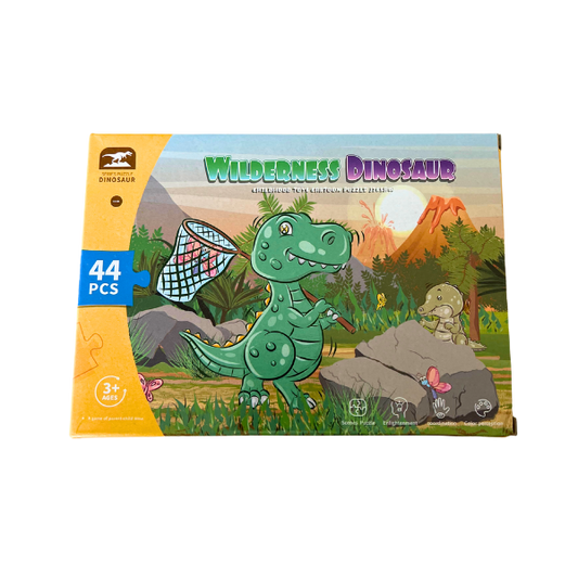 Box titled Wilderness  Dinosaur showing a green dinosaur with a butterfly net in the wilderness. Box states there are 44 pieces to the puzzle.