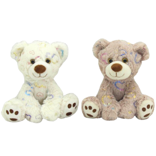 Two soft plush teddies, one cream, the other light brown. Both have embroidered hearts all over