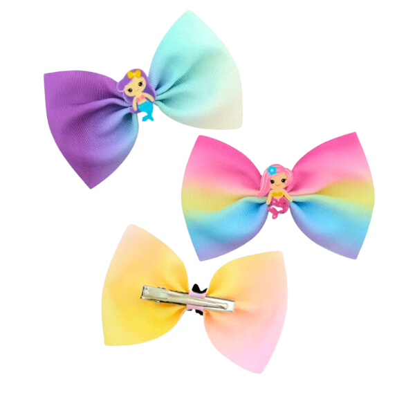 Three pastel coloured girls bow clips