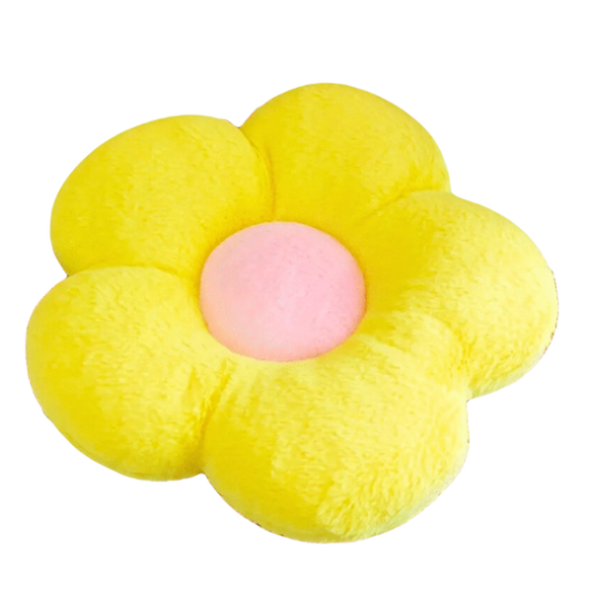 Yellow flower shaped plush cushion with yellow petals and a pink centre.